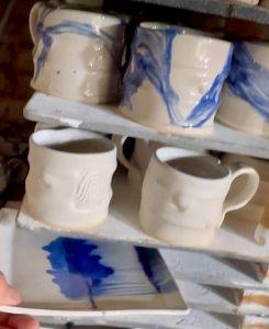 Ceramic mugs drying on rack at David Pinto pottery studio in Trelawny, Jamaica.