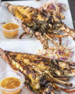 Grilled lobster served with garlic butter sauce at Sharkies Seafood Restaurant in Runaway Bay, Jamaica.