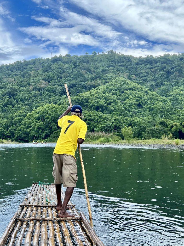 Bamboo rafting experience on a lush river in Jamaica arranged for guests staying at our luxury villas.