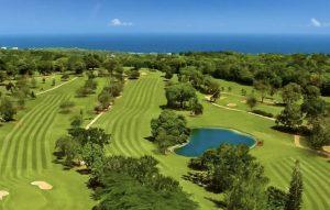 Aerial view of Upton Estate Golf Course in Ocho Rios Jamaica with ocean views.
