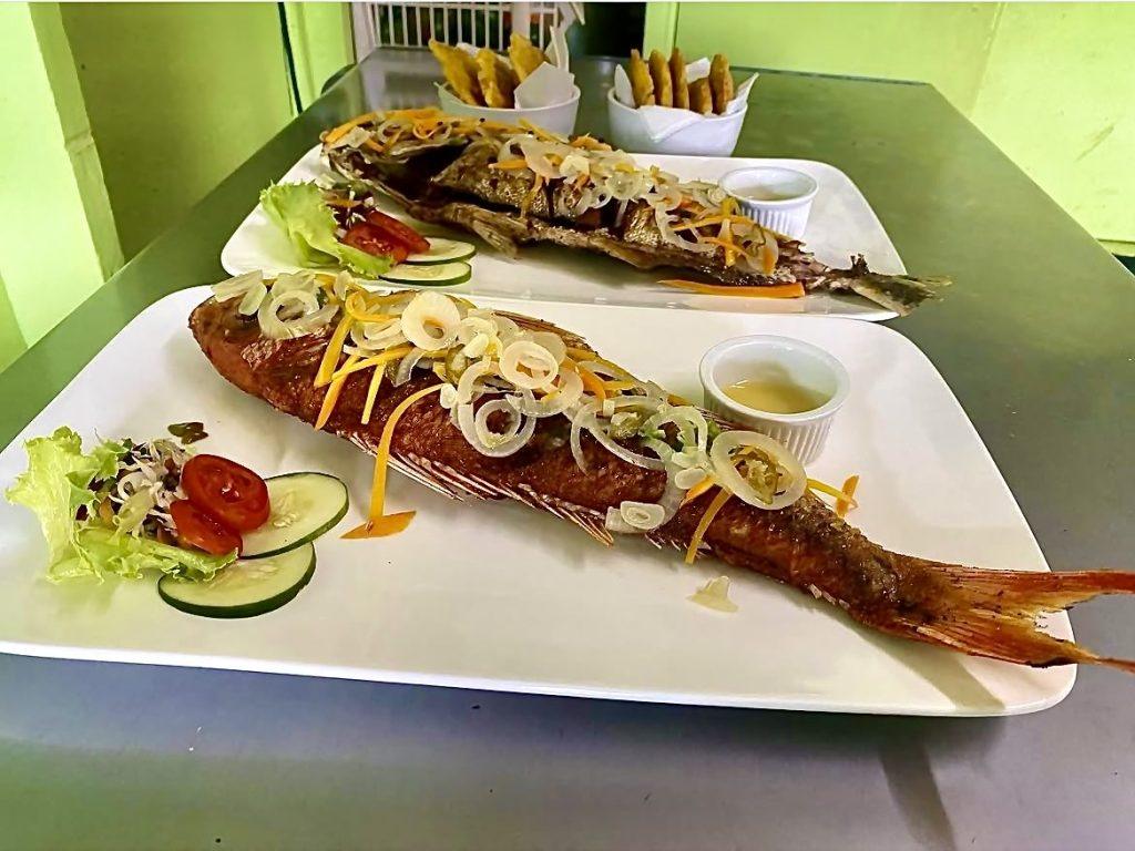 Traditional Jamaican escovitch fish served at Jangalee Seafood Restaurant in Ocho Rios, Jamaica.