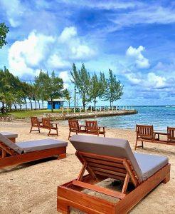 Beachfront loungers overlooking the Caribbean Sea at East Beach Club in St Mary Jamaica.