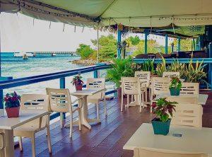 Waterfront dining deck at Ocean's 11 Seafood Restaurant in Ocho Rios Jamaica.
