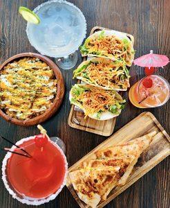 Tacos quesadillas cocktails and loaded fries at Papi Chulo in Ocho Rios Jamaica.
