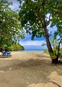 Secluded beach at Pleasure Cove Beach Bar & Restaurant on White River Bay in Ocho Rios Jamaica.