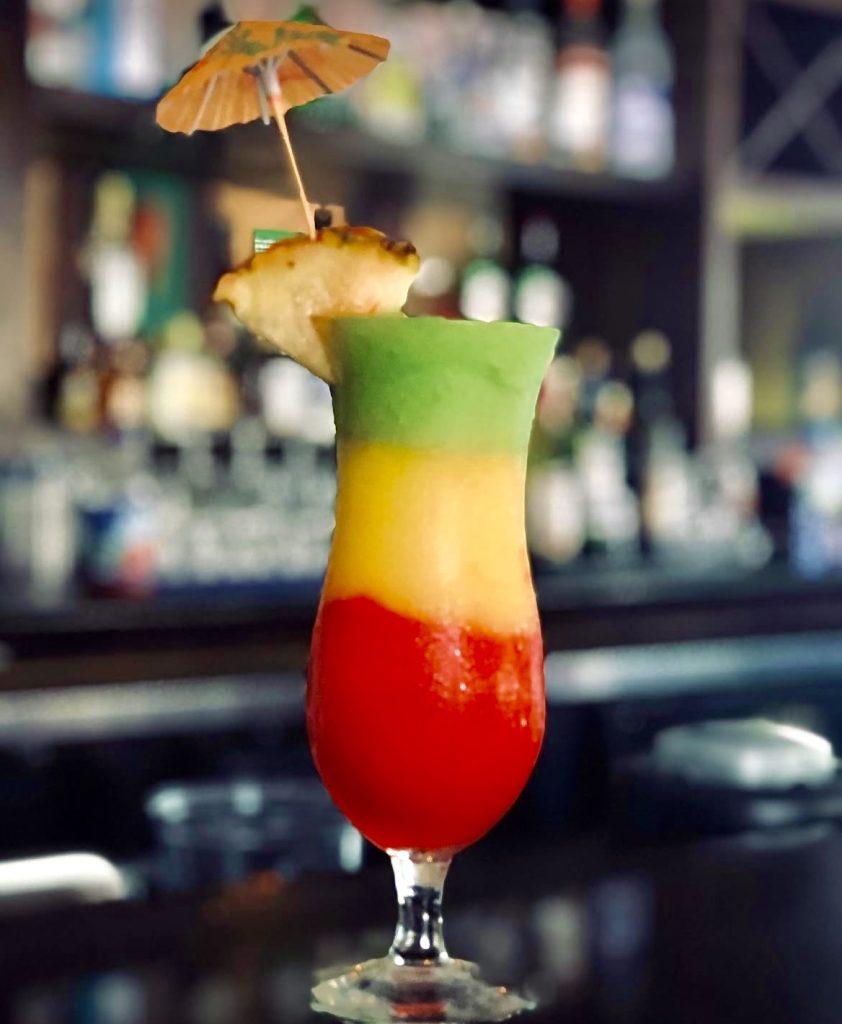 Colourful tropical cocktail at John Crow's Tavern Ocho Rios.